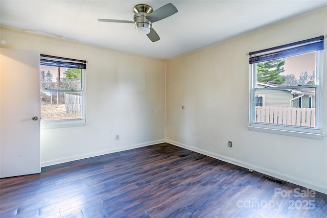 unfurnished room with dark hardwood / wood-style flooring and ceiling fan