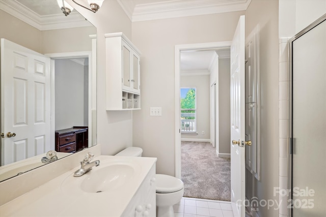 bathroom featuring baseboards, toilet, tile patterned flooring, crown molding, and vanity