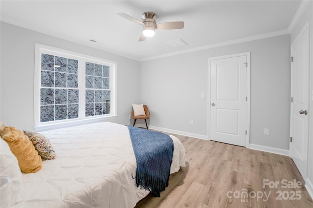 bedroom with crown molding, ceiling fan, and light hardwood / wood-style floors