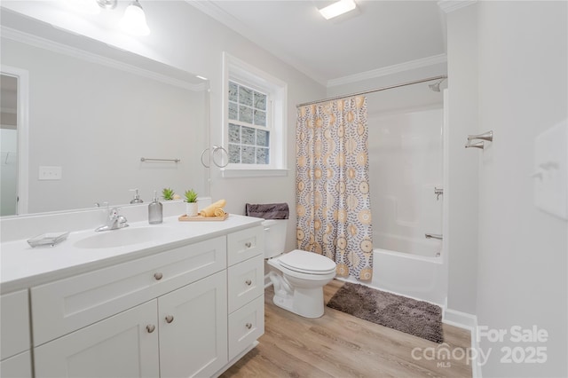 full bathroom featuring toilet, crown molding, vanity, shower / bath combination with curtain, and hardwood / wood-style floors