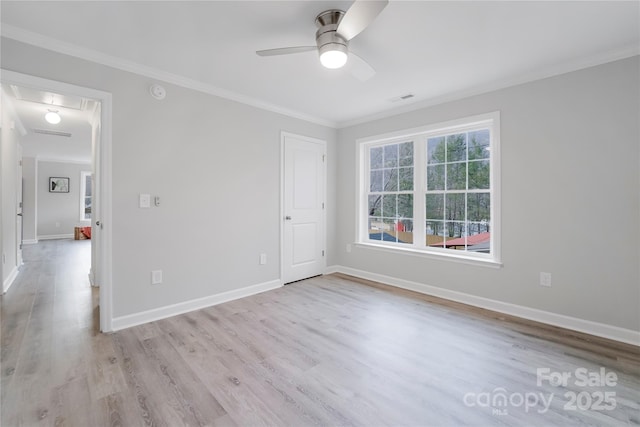 unfurnished room featuring ceiling fan, ornamental molding, and light hardwood / wood-style flooring