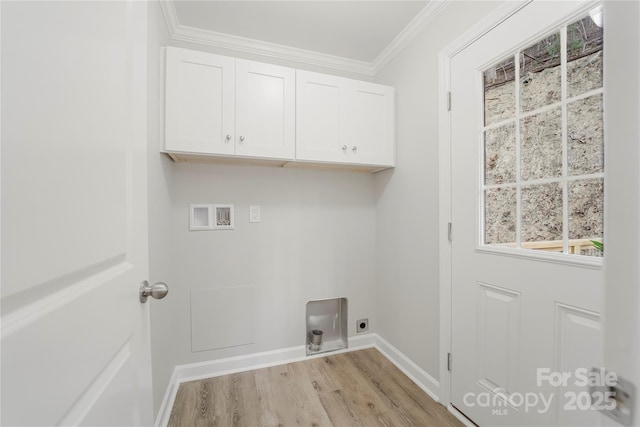 clothes washing area with crown molding, cabinets, light hardwood / wood-style flooring, electric dryer hookup, and washer hookup