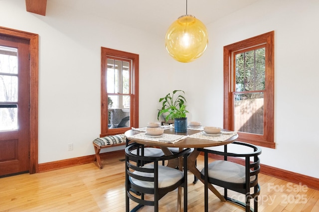 dining space featuring light wood-type flooring