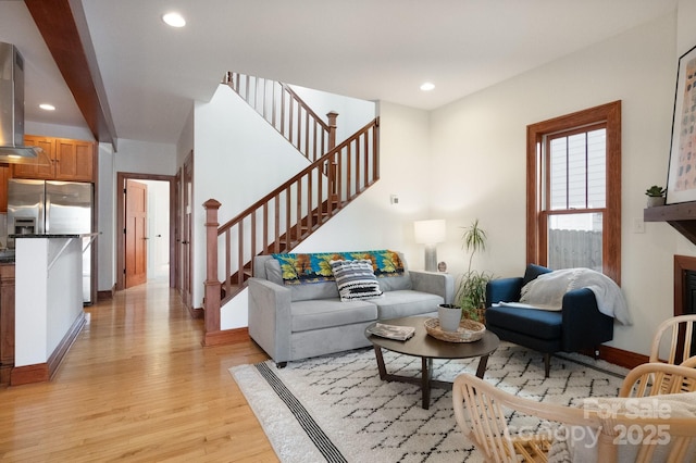 living room with light hardwood / wood-style flooring