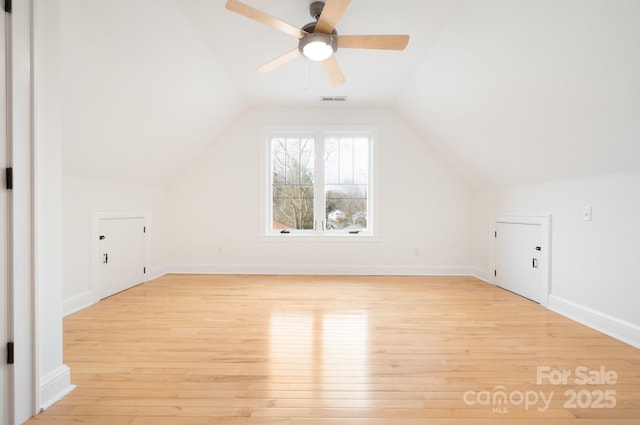 additional living space with lofted ceiling, light hardwood / wood-style floors, and ceiling fan