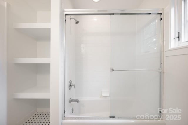 bathroom featuring enclosed tub / shower combo