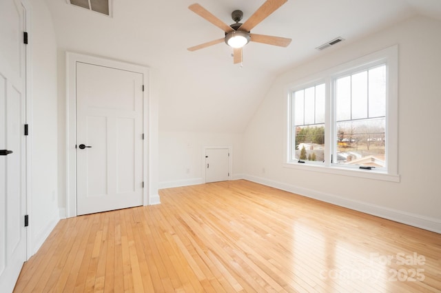 additional living space featuring vaulted ceiling, light hardwood / wood-style floors, and ceiling fan