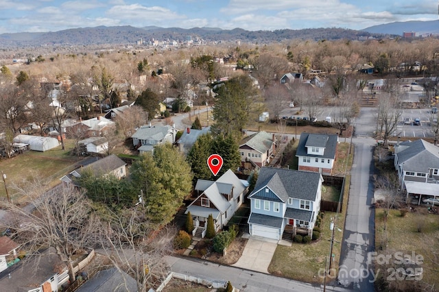 birds eye view of property featuring a mountain view