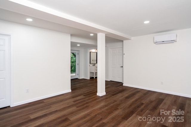 3925 Blackberry Crest Ln, Lenoir, NC 28645 - basement with a wall mounted air conditioner, dark wood-style floors, recessed lighting, and baseboards