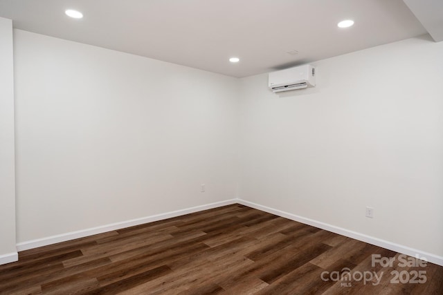 3925 Blackberry Crest Ln, Lenoir, NC 28645 - unfurnished room featuring dark wood-style flooring, a wall unit AC, recessed lighting, and baseboards