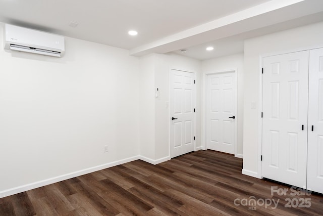 3925 Blackberry Crest Ln, Lenoir, NC 28645 - below grade area featuring a wall mounted AC, recessed lighting, dark wood finished floors, and baseboards
