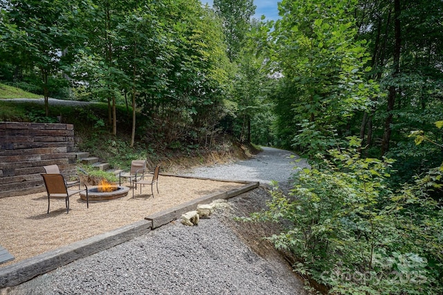3925 Blackberry Crest Ln, Lenoir, NC 28645 - view of yard with a fire pit and a patio area