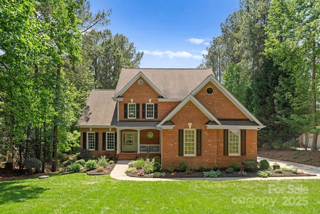 craftsman inspired home featuring a porch and a front yard