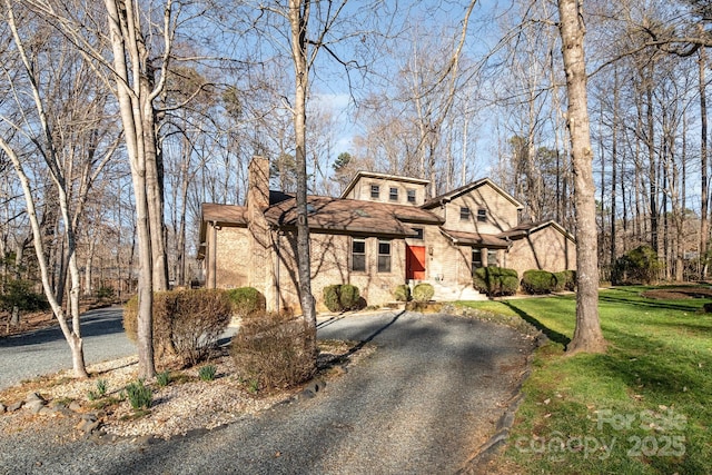 1006 Lost Cv, Weddington, NC 28104 - view of front of property with driveway, a chimney, and a front yard