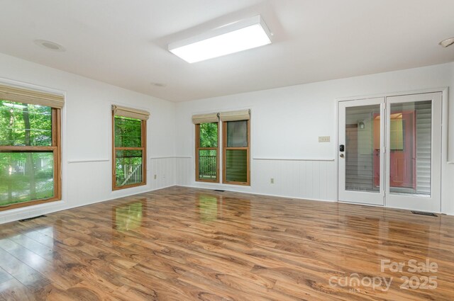 1006 Lost Cv, Weddington, NC 28104 - unfurnished room featuring wood finished floors and wainscoting