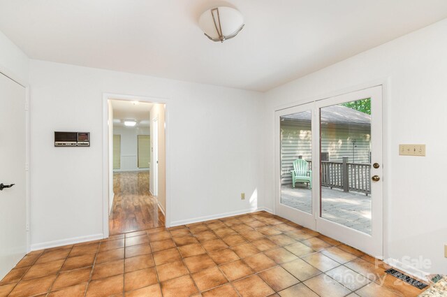 1006 Lost Cv, Weddington, NC 28104 - spare room with baseboards and light tile patterned floors
