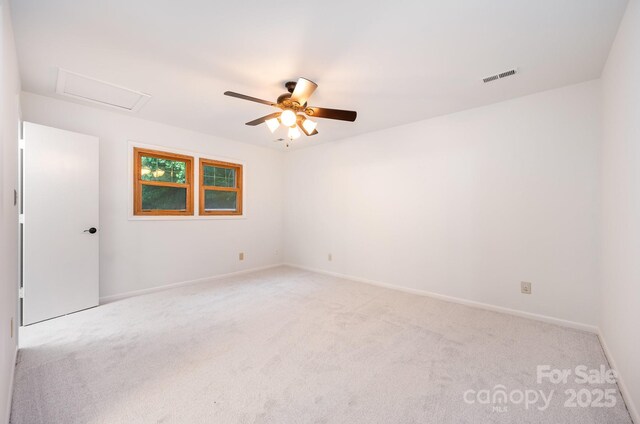 1006 Lost Cv, Weddington, NC 28104 - empty room with attic access, light carpet, and a ceiling fan