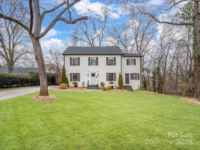 colonial home with a front yard