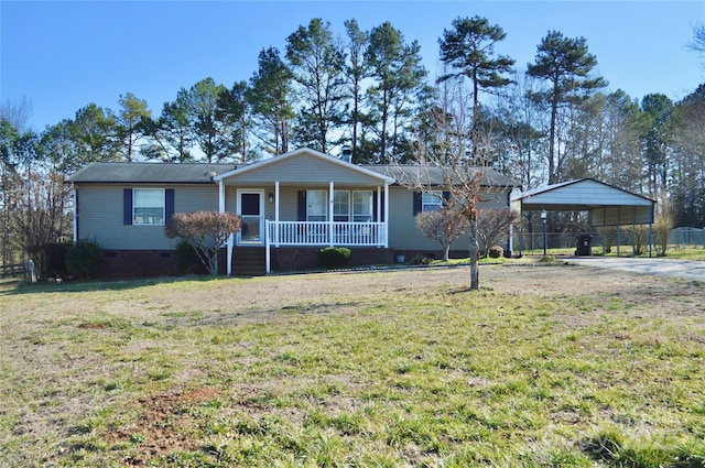 ranch-style home with a carport, covered porch, and a front lawn