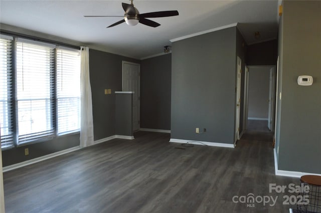 unfurnished room featuring dark wood-type flooring, ceiling fan, and ornamental molding