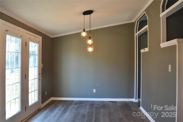 unfurnished dining area with crown molding, a healthy amount of sunlight, and dark wood-type flooring