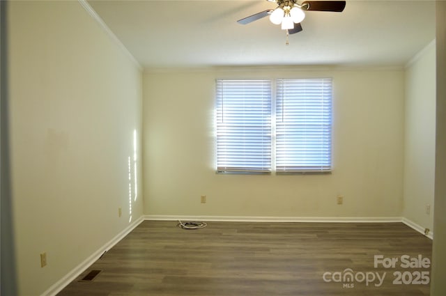 spare room featuring crown molding, ceiling fan, and dark hardwood / wood-style floors