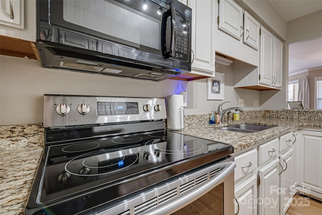 kitchen with white cabinets, sink, and stainless steel range with electric cooktop