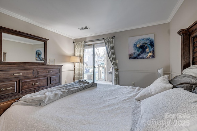 bedroom with ornamental molding and access to exterior