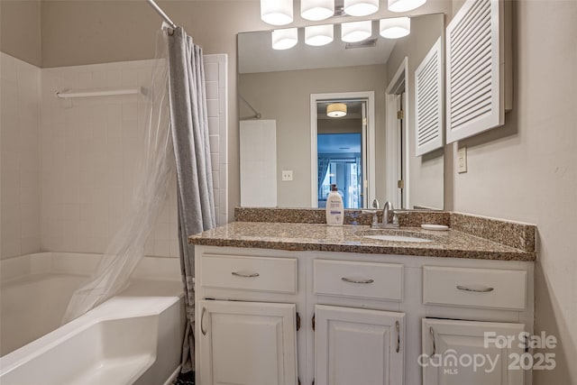 bathroom with vanity and shower / bath combination with curtain