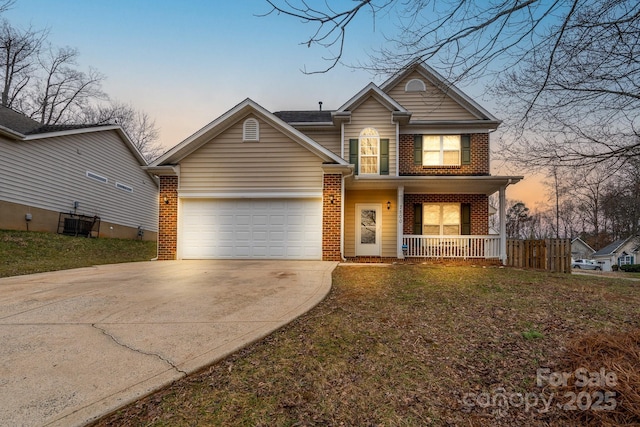 front facade featuring a garage and covered porch