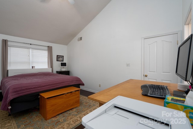 bedroom featuring high vaulted ceiling