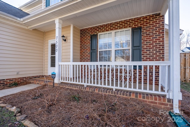 doorway to property featuring covered porch