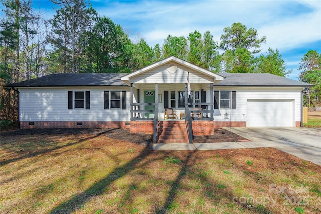 ranch-style house with a garage, a front yard, and a porch