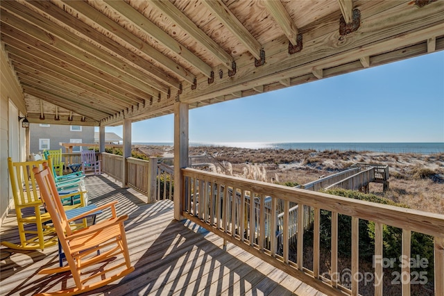 wooden terrace with a water view