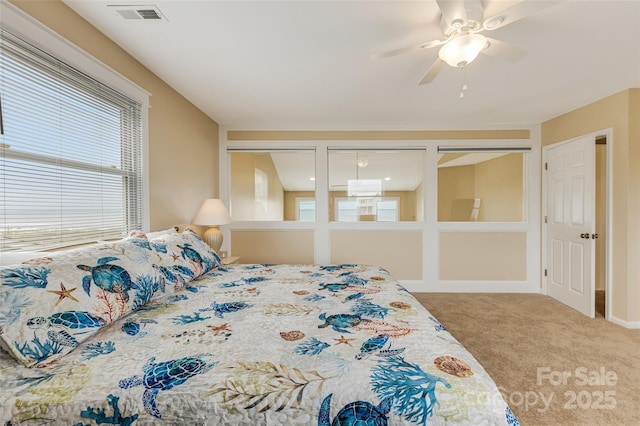 2221 E Beach Dr, Oak Island, NC 28465 - bedroom with carpet floors and ceiling fan