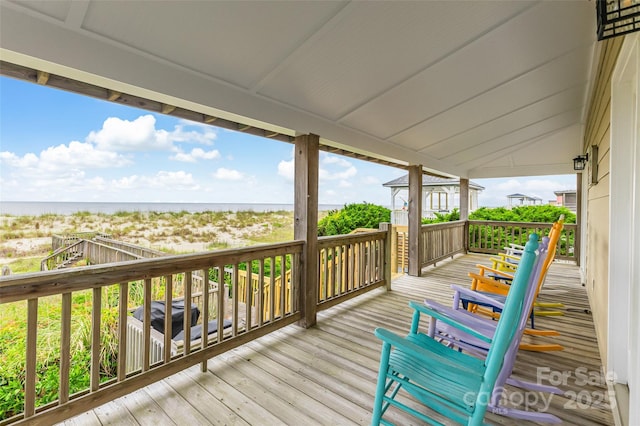 2221 E Beach Dr, Oak Island, NC 28465 - wooden terrace featuring a water view