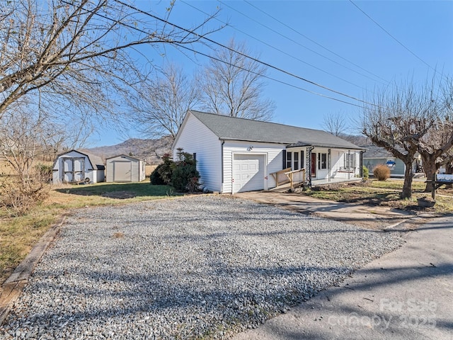 ranch-style home with a shed, a garage, and a porch