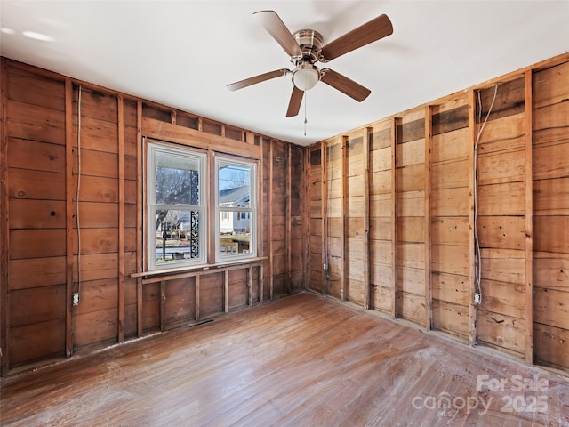 unfurnished room featuring hardwood / wood-style flooring and ceiling fan