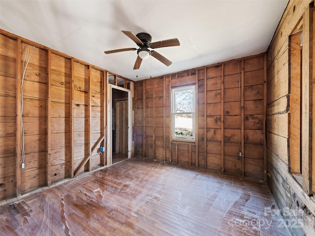 unfurnished room with ceiling fan