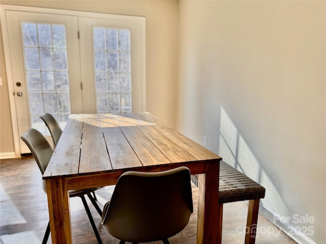 dining area with wood finished floors