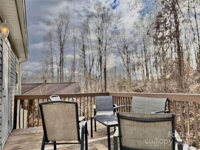 wooden deck with outdoor dining area