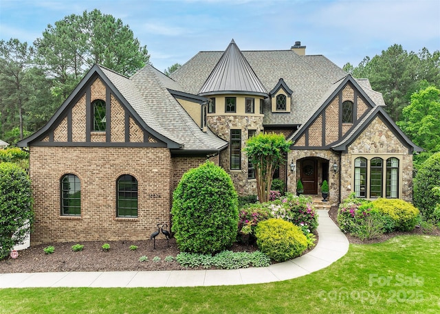 tudor house with a front lawn