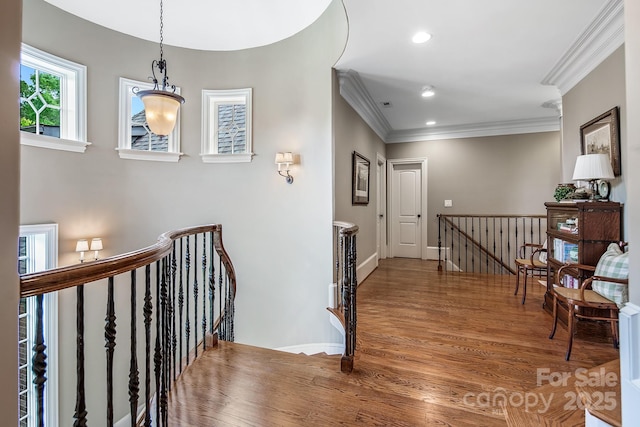 hall featuring crown molding and wood-type flooring