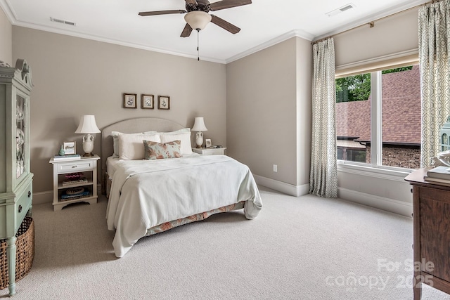 carpeted bedroom with crown molding and ceiling fan