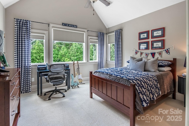 bedroom featuring vaulted ceiling, light colored carpet, and ceiling fan