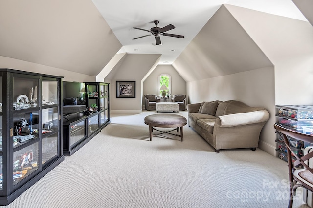 carpeted living room with lofted ceiling and ceiling fan