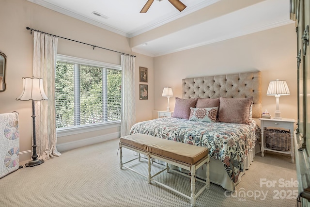carpeted bedroom featuring crown molding and ceiling fan