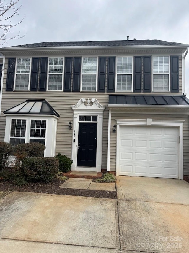 view of front of property with a garage