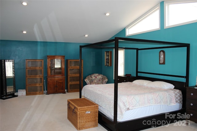 bedroom featuring lofted ceiling, recessed lighting, and light colored carpet