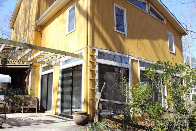 view of home's exterior featuring a pergola